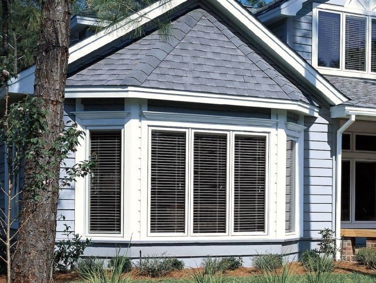 New bay window on a blue-gray home